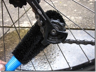 Cleaning bike picture of brush in rear mech