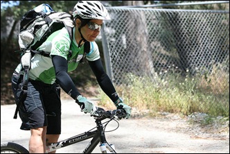 cyclist stands on bike nice cycling shorts