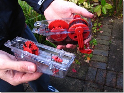 Halfords bike cleaning kit in two parts with a lottle of dirt at bottom