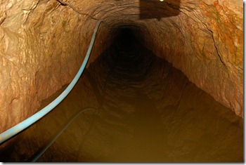Speedwell Cavern in the Peak District, travelling into the cave with water