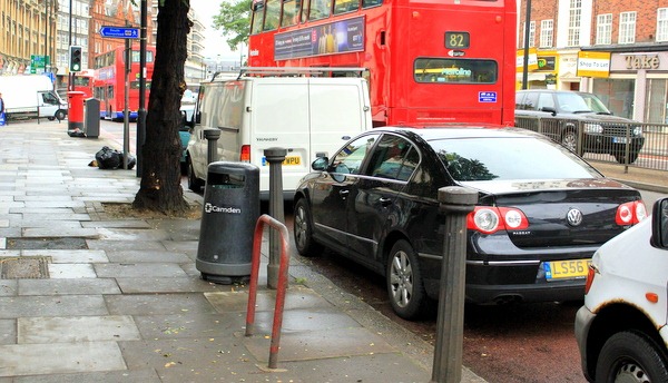 Cars parked in the bus lane