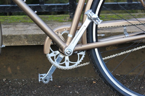 Creme cafe racer zoomed in on the pedals