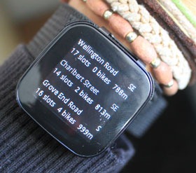 Cycle hire gadget on the display screen of the live view strapped to a wrist