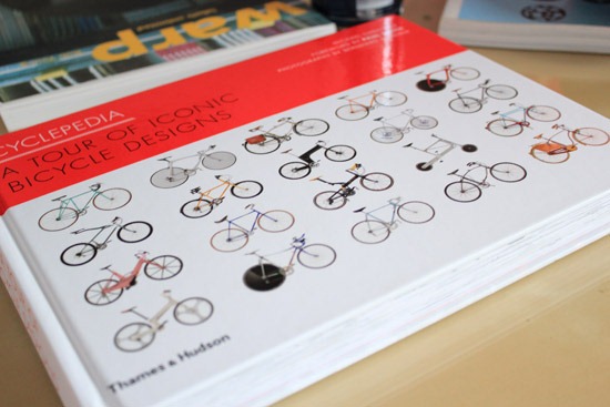 Cyclepedia book on coffee table next to Warp book