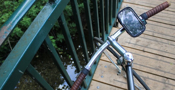 Ultimatemobiles iPhone bike mount on handlebars with view of Wandle River behind