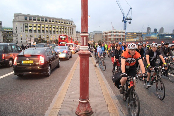 Cyclists on the right side of Blackfriars and motorists on the other