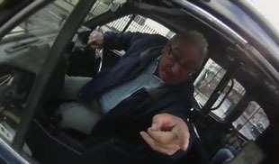 Irrate taxi driver pointing