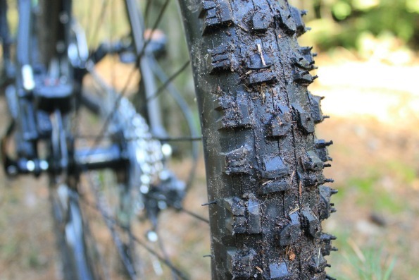 Close up of the knobbly tires on the Voodoo Canzo with mud and other debris