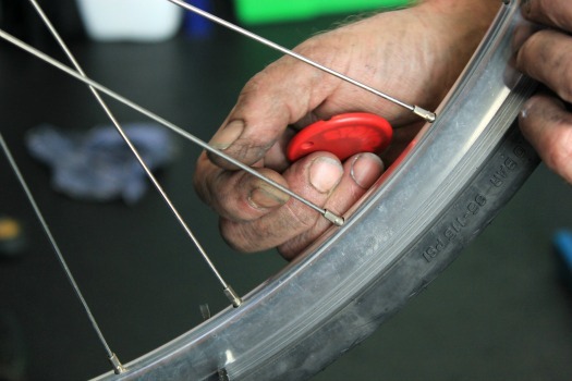 Plucking the bike wheel spokes