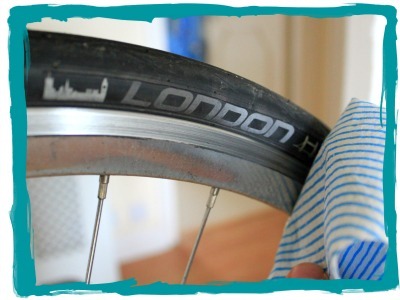 Wiping away muck from bicycle wheels