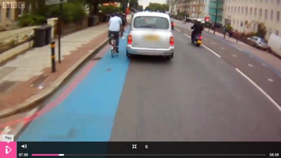 Car passing by a cyclist