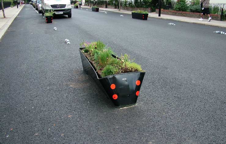 Some of the planters on Royal College Street have been damaged by motorists - image from Alternative Department for Transport